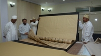 The Qur'an of Baroda under repair in Noor Microfilm Centre